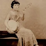 Bunny in white lace – seated — Genevieve “Bunny” Longo